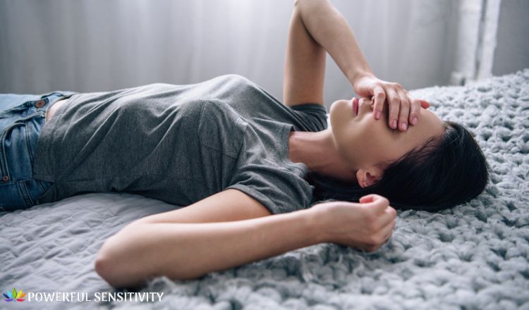 exhausted sensitive woman in bed